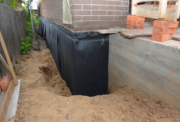 Happy homeowners after waterproofing job in Florence